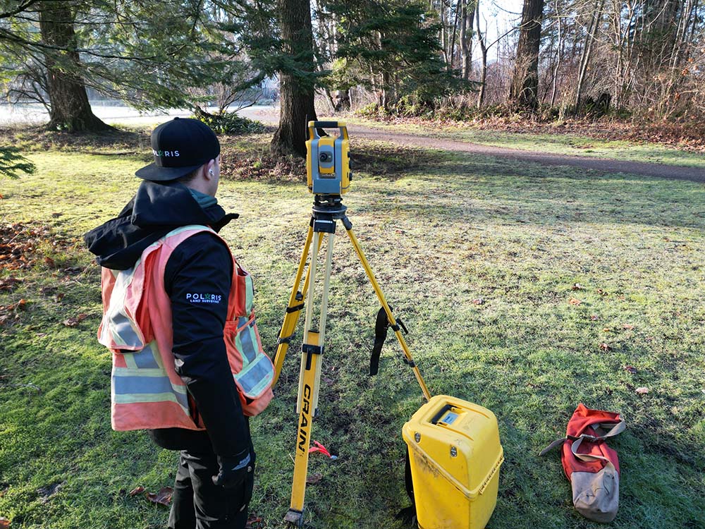 A picture of surveying tool by the rocky shore overlooking the ocean